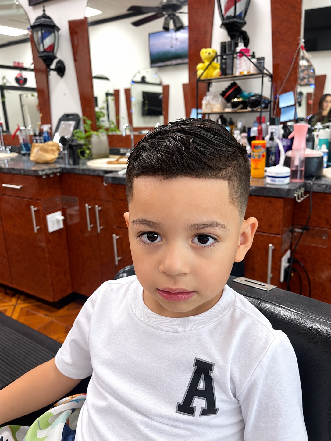 Boy's finished short haircut from the front at Zara Barbershop