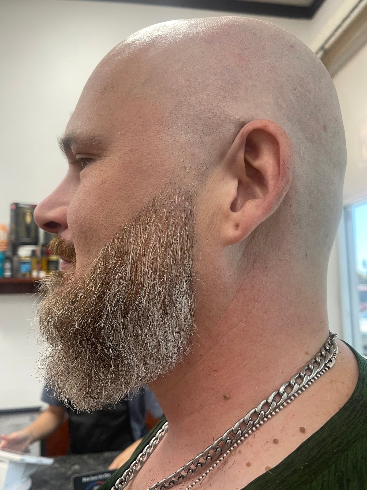 Clean bald head with sculpted full beard