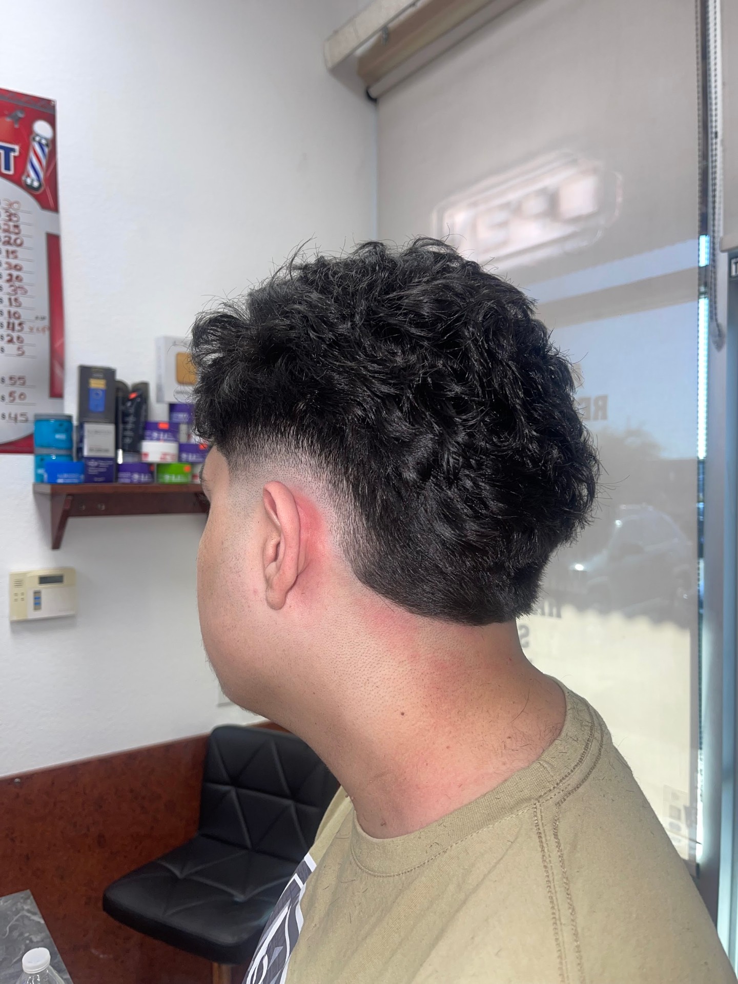 Textured top with low taper fade